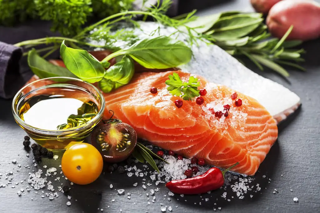 6 Foods That Boost Brain Health 2 a piece of salmon with herbs and spices is excellent for brain health