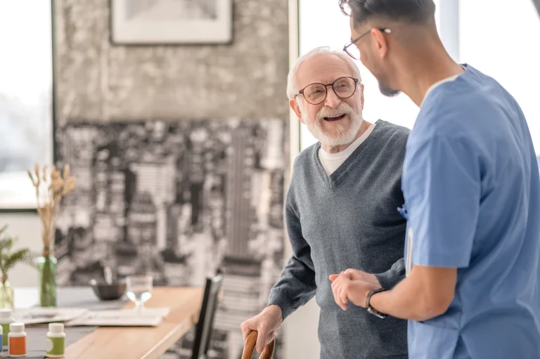 A caregiver assisting a senior at home